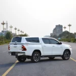 MARKS M7 Sports Canopy for Toyota Hilux Revo parked on wide city road