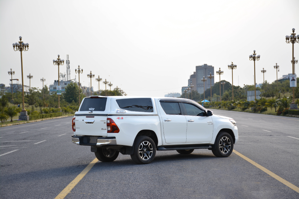 MARKS M7 Sports Canopy for Toyota Hilux Revo parked on wide city road