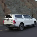 MARKS M7 Sports Canopy on Toyota Hilux Revo driving on mountain road