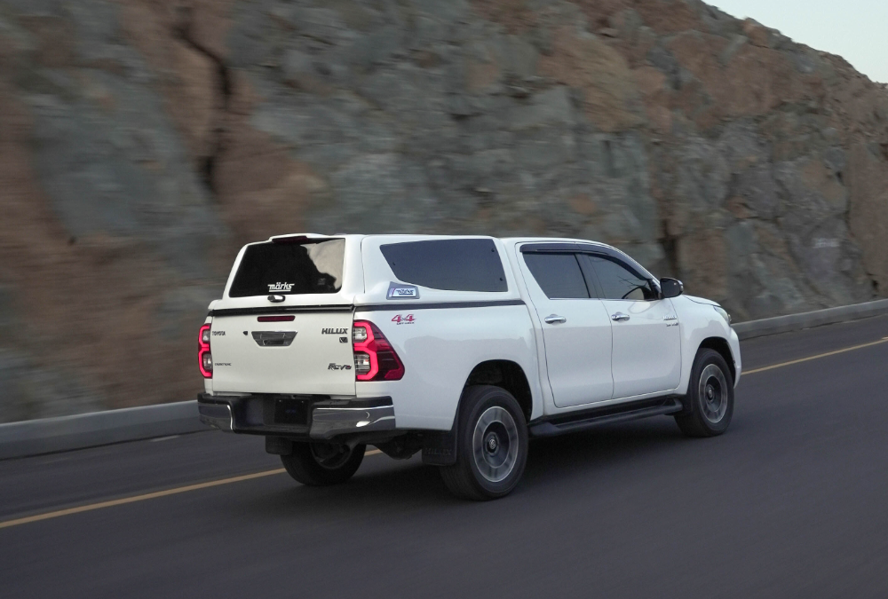 MARKS M7 Sports Canopy on Toyota Hilux Revo driving on mountain road